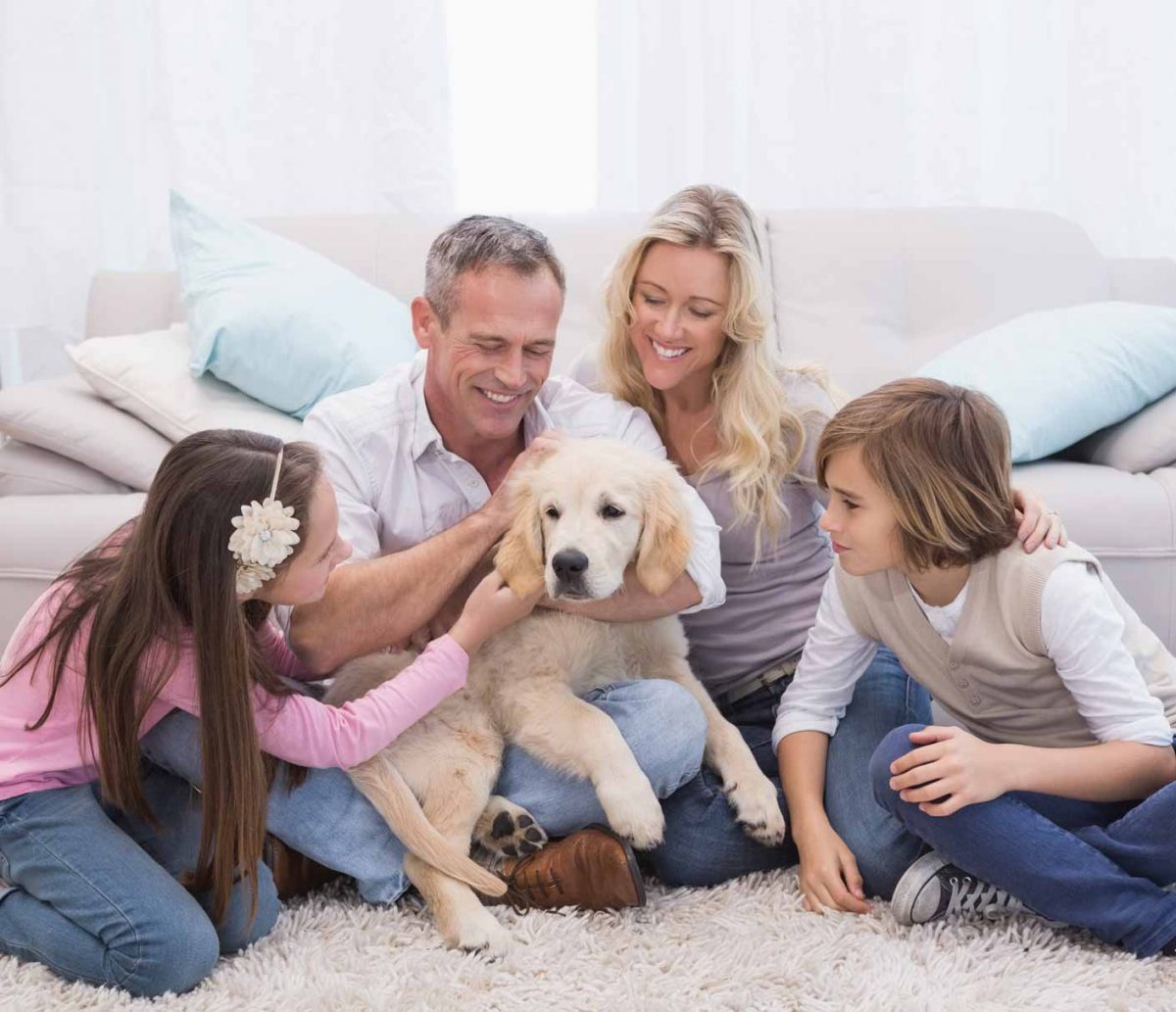 Family petting a dog