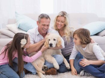 Family petting a dog