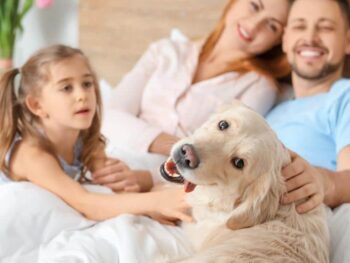Family happy bonding with dog